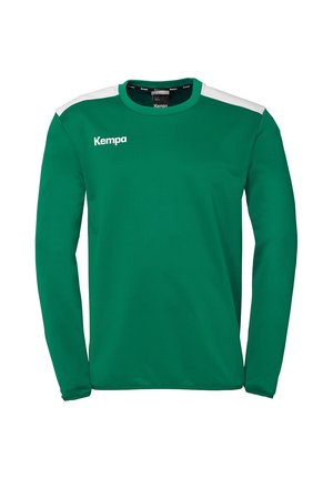 Green long-sleeve athletic shirt with white shoulder accents. Features a round neckline and "Kempa" logo in white on the chest.