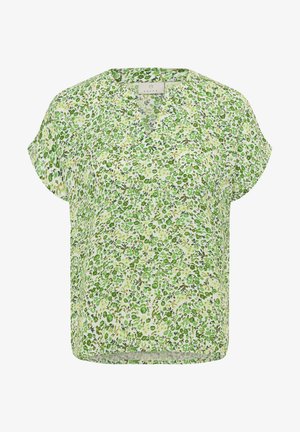 Lyhytnuorisella paidalla on kevyt, teksturoitu kangas, jossa on kukkakuosi, jossa on erilaisia vihreitä sävyjä vaaleankeltaisella taustalla.