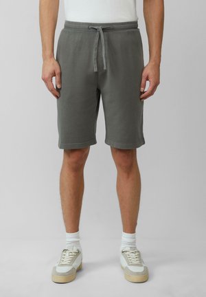 Shorts en coton gris avec une taille élastique et un cordon de serrage ajustable, présentant une coupe décontractée et une texture douce.
