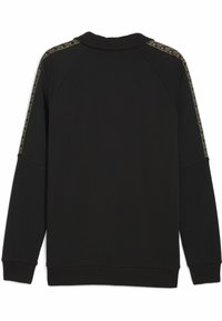 Sweat-shirt noir avec un col rond, des manches raglan longues et un accent doré à motif le long des coutures des épaules. Texture douce.
