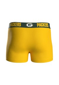 Zelené a žluté boxerky s zeleným pasem, na kterém je nápis "PACKERS" a kulaté logo uprostřed vpředu.