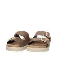 Brown suede sandals with two adjustable straps, gold-tone buckles, cork footbed, and white rubber outsole featuring a textured pattern.