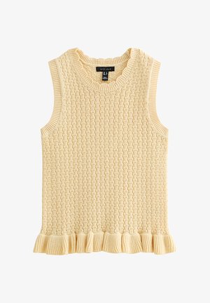 Chaleco de punto sin mangas color crema con patrón de trenzas y dobladillo con volantes, que presenta un cuello redondo y sisas acanaladas.