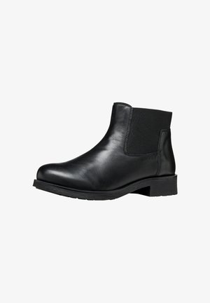 Botín de cuero negro hasta el tobillo con paneles laterales elásticos, punta redonda, tacón bajo y suela de goma texturizada. Superficie lisa con un diseño minimalista.