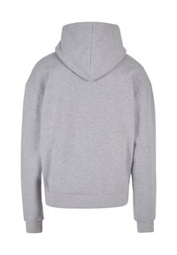 Felpa grigia con cappuccio, realizzata in tessuto morbido, caratterizzata da una vestibilità comoda, maniche lunghe e orlo inferiore a costine. Senza dettagli grafici.