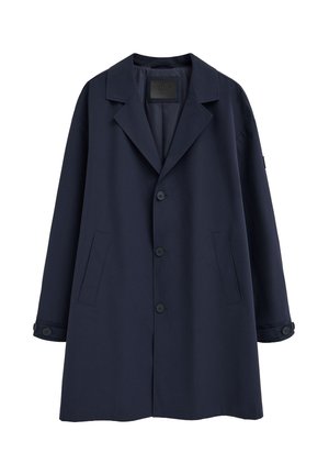 Manteau bleu marine à simple boutonnage avec col à revers cranté, trois boutons sur le devant, poches latérales et poignets à boutons.