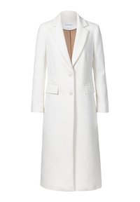 Manteau blanc sur mesure avec un tissu texturé, à boutonnage simple, revers crantés, deux poches frontales et boutons. L'intérieur est beige.