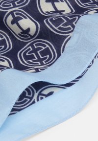 Cotton scarf featuring a navy blue background with white circular patterns and light blue border, smooth texture, folded at an angle.