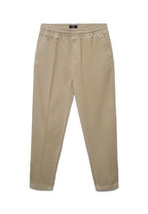 Pantaloni in corduroy beige con vestibilità rilassata, caratterizzati da una gamba affusolata, una vita elastica e una sottile trama a coste.