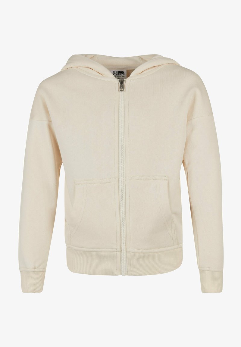 Gai bēša krāsas rāvējslēdzēja jaka ar priekšējo kabatu, ribotiem piedurkņu galiem un apakšmalu. Iespējā kapuce un mīksta, teksturēta auduma.