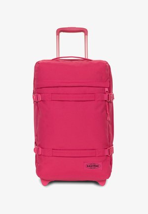Růžový měkký kufr s vysouvací rukojetí, bočními popruhy, odolnou látkou a logem vespod.
