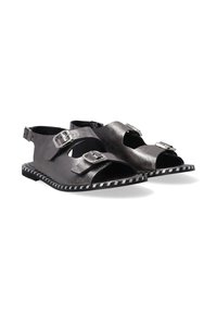 Schwarze Leder-Sandalen mit mehreren verstellbaren Schnallen, offener Zehenpartie und einem gestreiften Sohlenmuster. Verfügt über einen flachen Absatz und ein elegantes Design.