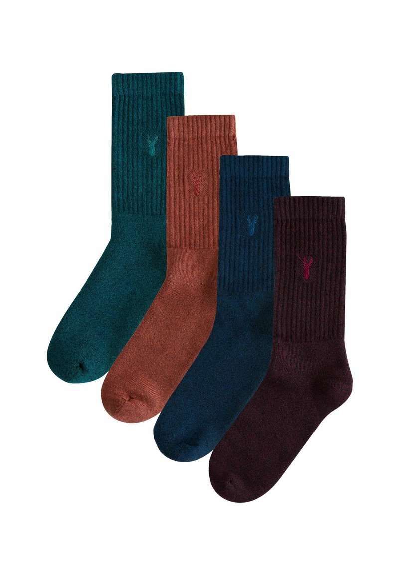 Four pairs of ribbed socks in dark green, rust, dark blue, and burgundy colors. Each has a small logo near the top. Soft texture.