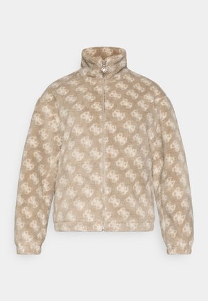 Fleecejakke i beige med et lyst beige mønster. Har høy krage, glidelåslukking og elastiske mansjetter. Myk tekstur.