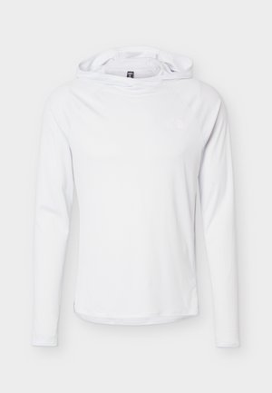 Bela majica z dolgimi rokavi in kapuco iz lahkega blaga z nežnim logotipom na prsih, prikazana na enostavnem svetlem ozadju.