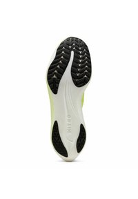 Suela de zapato con una banda de rodadura de goma negra y un cuerpo de espuma blanca, con líneas curvas y un logo. El color es verde claro cerca del borde superior.