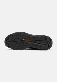 Suola nera per scarpa con motivo del battistrada robusto e logo Continental arancione al centro, progettata per uso esterno o trail.