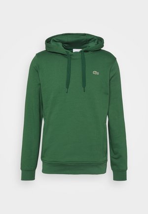 Ciemnozielona bluza z kapturem i długim rękawem, ze sznurkami, kieszenią kangurka, prążkowanymi mankietami i małym haftowanym logo krokodyla na piersi.
