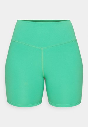 Zelene športne kratke hlače iz raztegljivega materiala, s visokim pasom, gladko teksturo in kontrastnimi šivi.