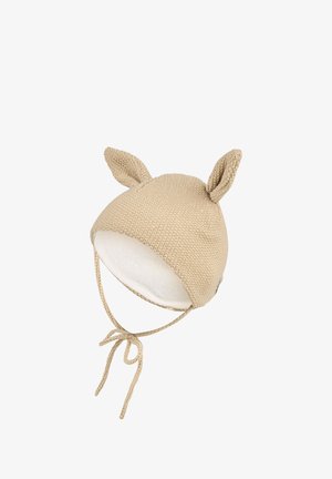 Beige knitted baby hat with two small ears on top and chin ties, lined with soft white fabric inside.