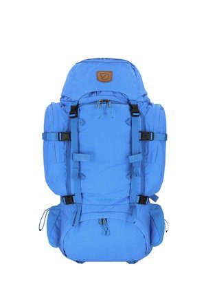 Blue hiking backpack with adjustable straps, top flap, and side pockets. Made of durable fabric, featuring a leather logo patch and drawstring closure.