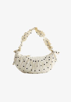 Handtasche aus Cremestoff mit schwarzen Polka-Dots, gerafftem Körper und einem gefältelten Griff, der an beiden Enden verknotet ist.