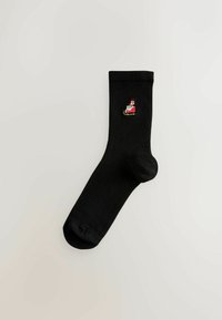 Schwarze Baumwollsocke mit einem kleinen, bunten, gestickten Design eines Schlitten mit Geschenken. Glatte Textur und gerippter Bund für einen sicheren Sitz.