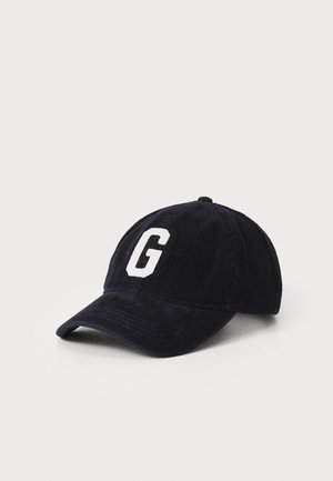 Casquette de baseball en velours côtelé bleu marine avec un "G" blanc brodé à l'avant, dotée d'une visière incurvée et d'un dos fermé.