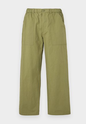 Olive green trousers made of cotton, featuring an elastic waistband, button closure, side pockets, and a loose, straight-leg design.