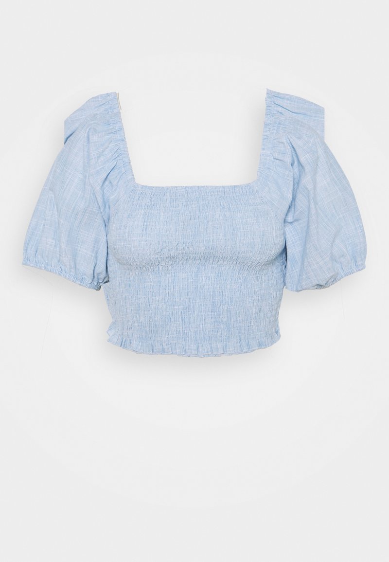 Light blue crop top with smocked bodice, square neckline, and puff sleeves. Made of textured fabric with a ruffled hem.