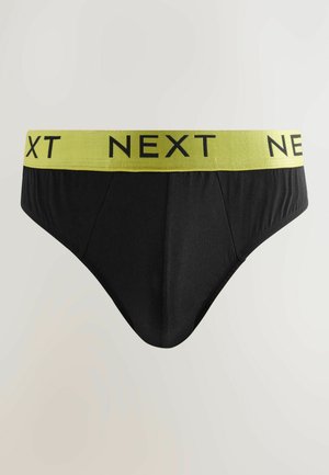 Črne boksarice z zelenim elastičnim pasom, na katerem je v črni pisavi napis "NEXT". Gladek material in oblikovana zasnova za udobno prileganje.