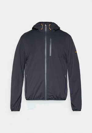 Fekete kapucnis dzseki cipzáros elülső résszel, oldalzsebekkel és rugalmas derékrésszel. Kontrasztos narancssárga részletek és sima textúra jellemzi.