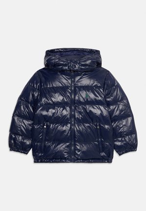 Navy blue puffer jacket with hood, front zipper, zippered side pockets, elastic cuffs, and small green embroidered logo on left chest.