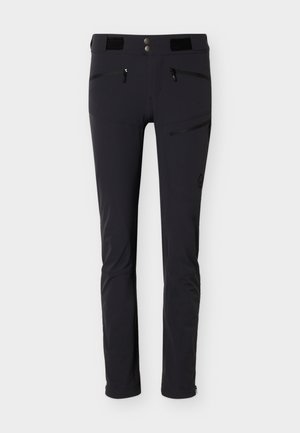 Črne ozke hlače za na prostem z zadrgami na sprednjih in stranskih žepih, dvojno zapiranjem na gumbe in nastavljivimi trakovi v pasu.