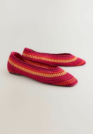 Crochet flat shoes with a pointed toe design, featuring a gradient pattern of pink, red, and yellow hues, made from a lightweight material.