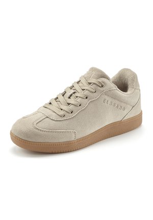Beige suede sneaker with beige laces and brown sole, featuring stitched details and embossed brand name on the side.