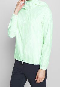 Lightweight, semi-sheer, mint-green jacket with a hood, vertical stripe pattern, zip closure, and elastic cuffs.