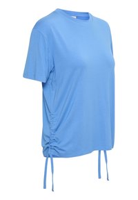 T-shirt bleu clair à manches courtes avec col rond et cordons latéraux ajustables créant un effet froncé de chaque côté.