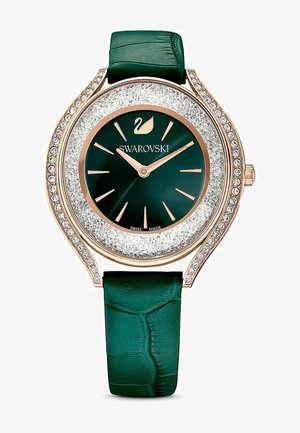 Swarovski-Uhr mit einem dunkelgrünen Lederarmband, runder Gehäuse aus Roségold, funkeln silberner Rand und einem dunkelgrünen Zifferblatt mit Kristallakzenten.