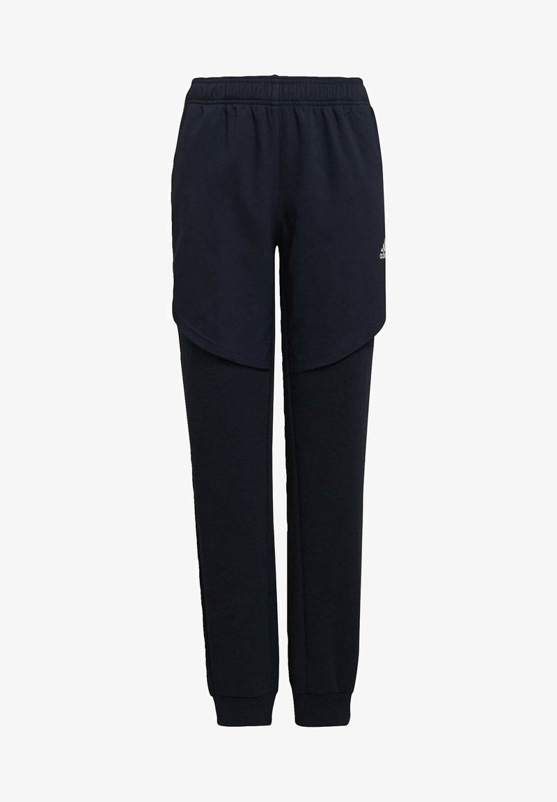 Pantalon de survêtement bleu marine avec une taille élastique, un design superposé à l'avant, et des ouvertures de jambes fuselées. Tissu doux et texturé.