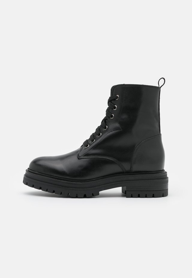 Bottines à plateau - noir