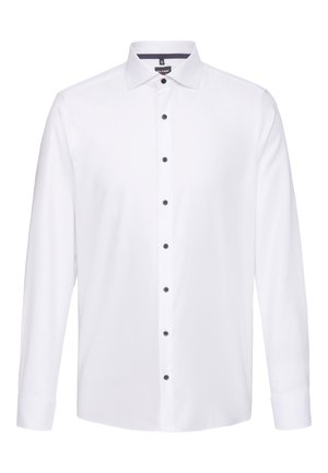 Camicia bianca a maniche lunghe con colletto, caratterizzata da bottoni neri sul davanti e ai polsini. Realizzata in tessuto morbido, con un design classico.