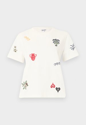 Haut blanc à manches courtes avec des motifs brodés colorés comprenant des palmiers, un vase, des feuilles, des cœurs et des formes abstraites éparpillés sur le tissu.