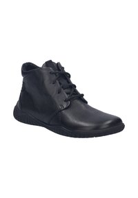 Bottines en cuir noir avec une finition texturée, bout rond et lacets à l'avant. La semelle en caoutchouc offre adhérence et flexibilité.