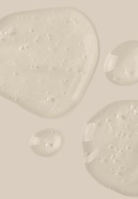 salted. SMOOTHING AHA BODY FLUID - Lotion pour le corps - Fragrance-Free