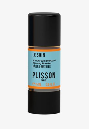 Schwarze zylindrische Flasche mit glänzendem Finish. Hellblaue Etikette mit schwarzem Text und orangefarbenen Akzenten. Fassungsvermögen 15 ml. Bräunungsverstärker-Produkt.