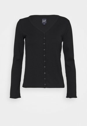 Cardigan noir à manches longues en maille côtelée avec col en V et fermeture à boutons sur le devant, étiqueté GAP, présenté sur un fond blanc.