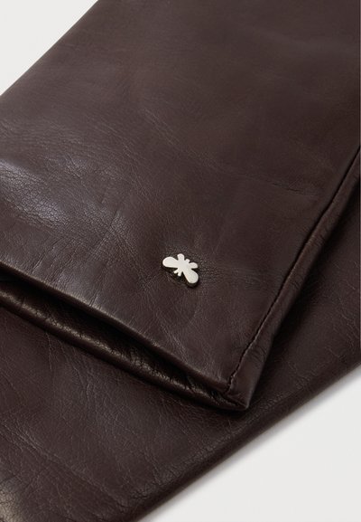 Dark brown folded leather gloves with a small silver insect-shaped decorative pin on the wrist area.