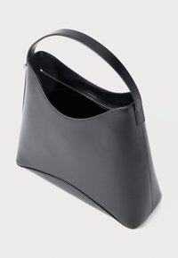 Black leather shoulder bag with a structured shape, wide top opening, and a single handle. Features a zipped interior compartment.