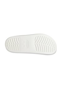 Suela de zapatilla de goma blanca con un patrón de banda texturizado y un logotipo central de la marca, diseñado para ofrecer agarre y comodidad.